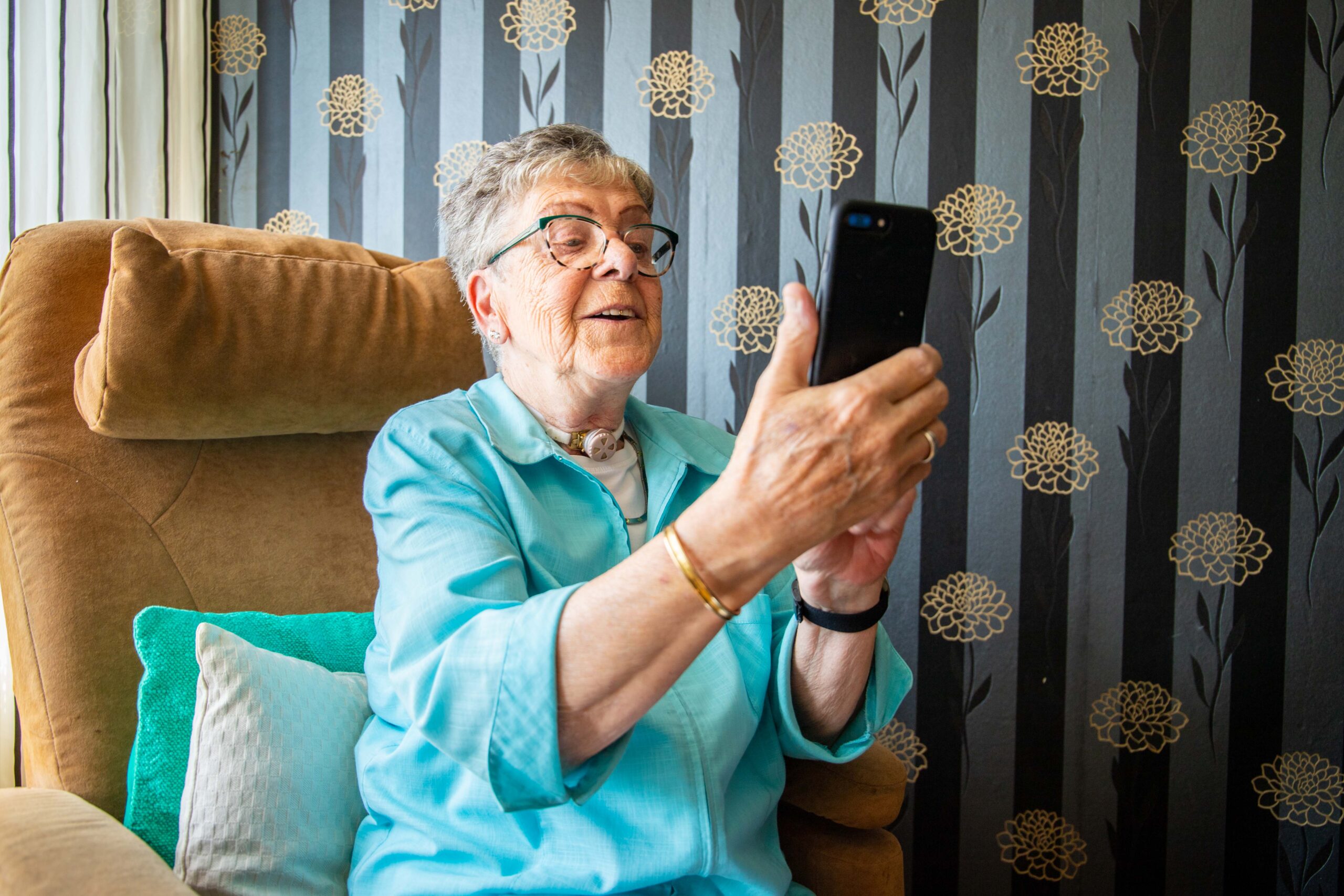 woman using freevent dualcare using phone